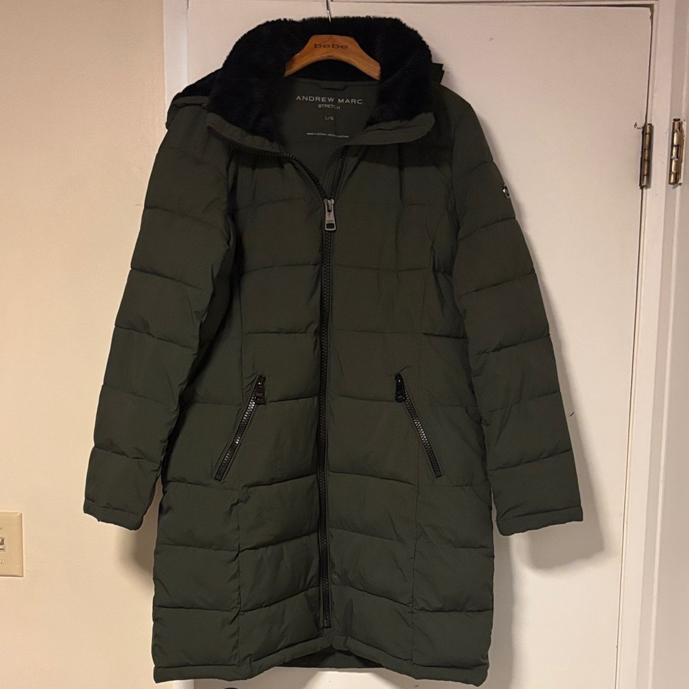 Mid length winter puffy coat. new without tags. measures 24 across chest